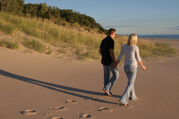 walking on beach holding hands